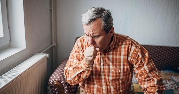 Elderly man in Pune suffering from URTI symptoms like cold and cough.